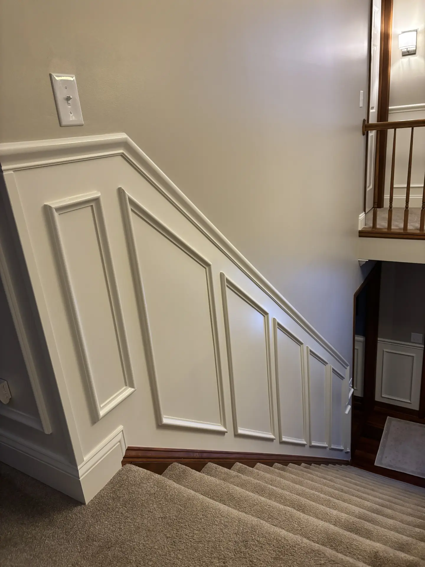 Angled wainscoting following stair line